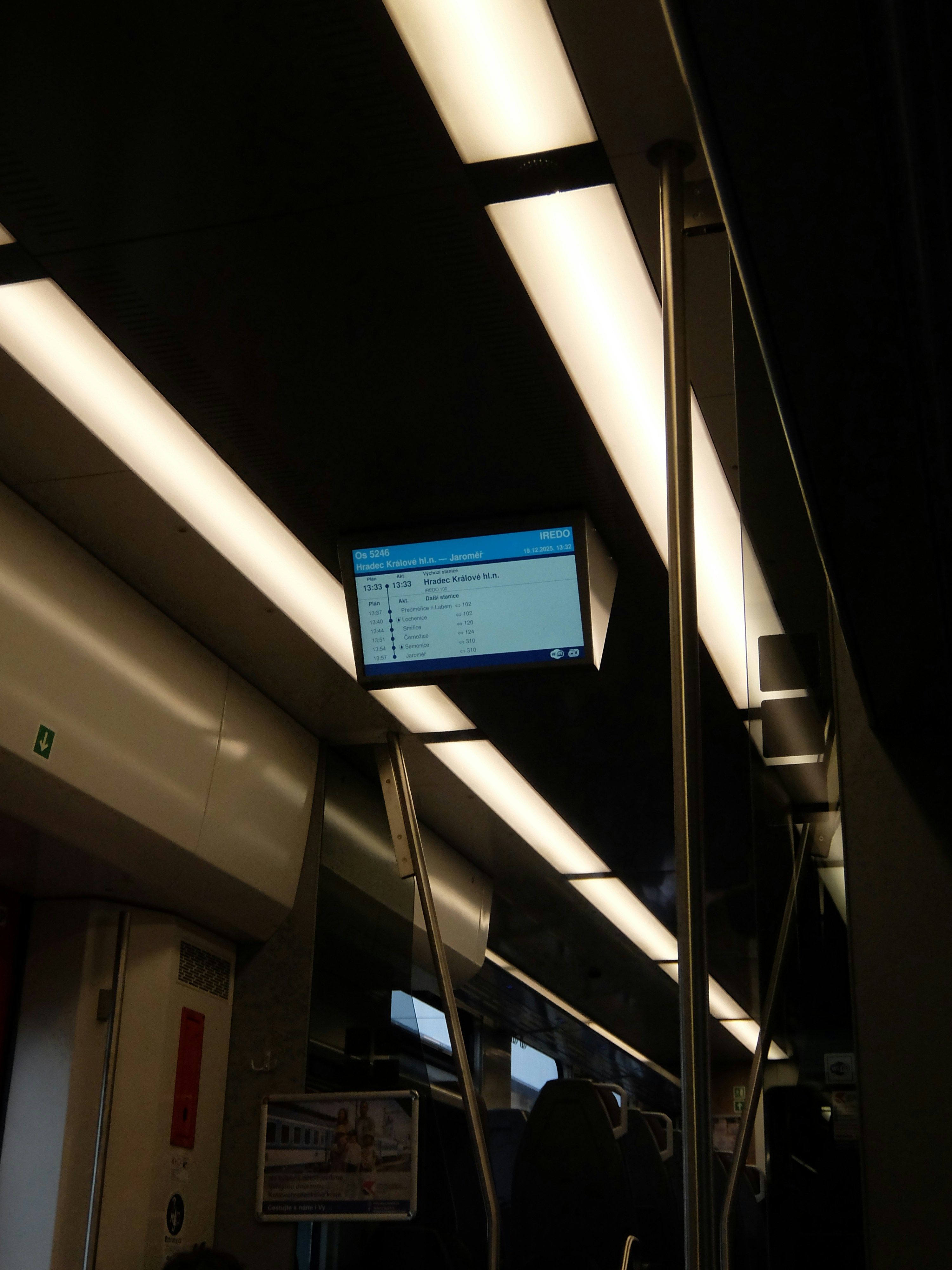 Digital display screen inside a train carriage.