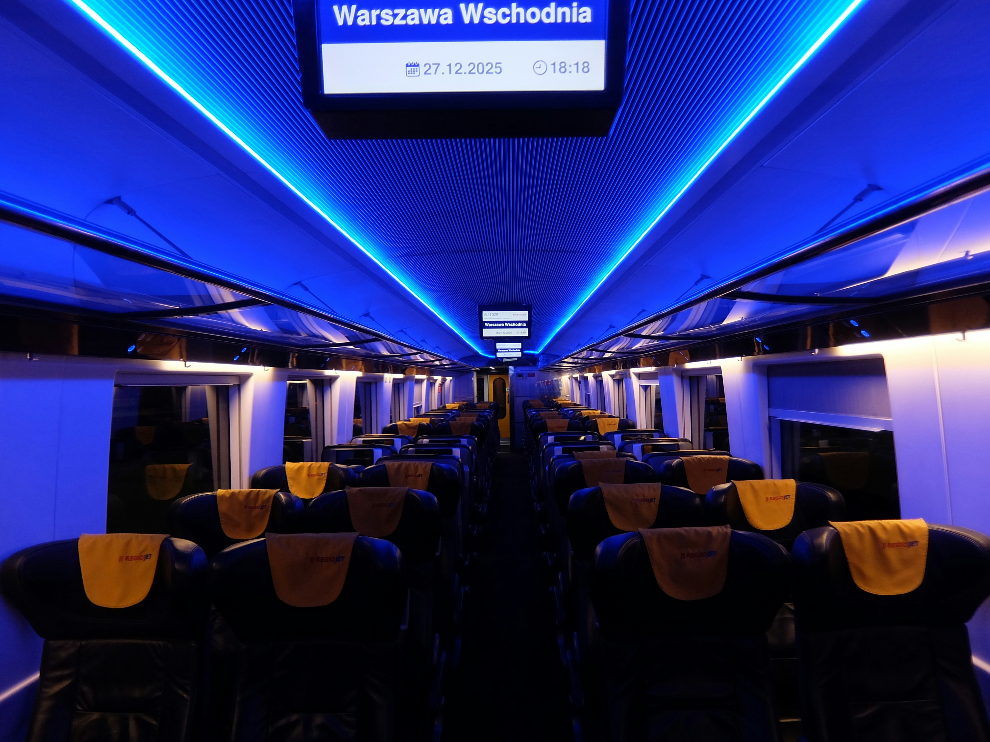 Empty train carriage with blue ambient lighting
