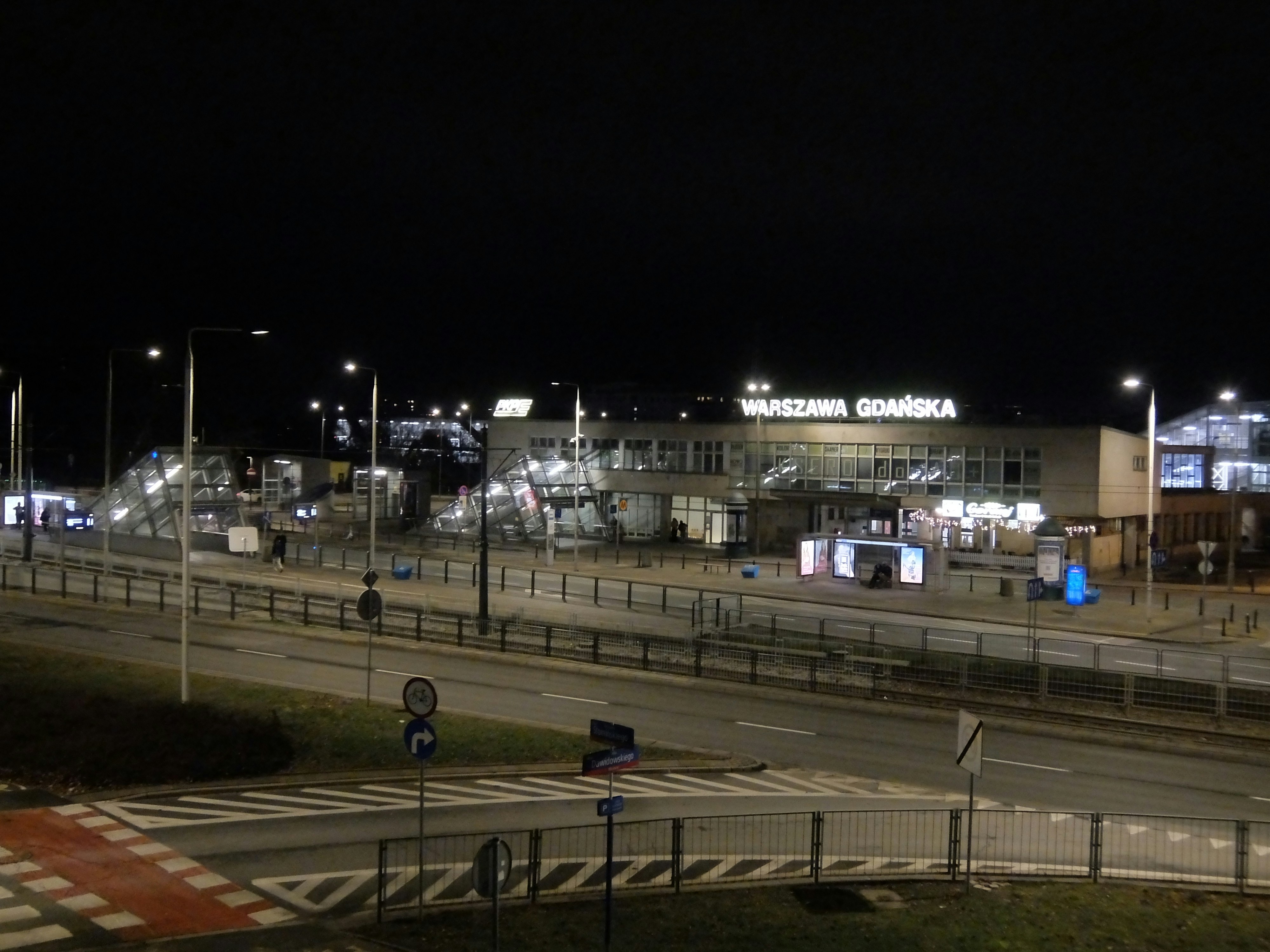 Modern train station illuminated at night with clear sky