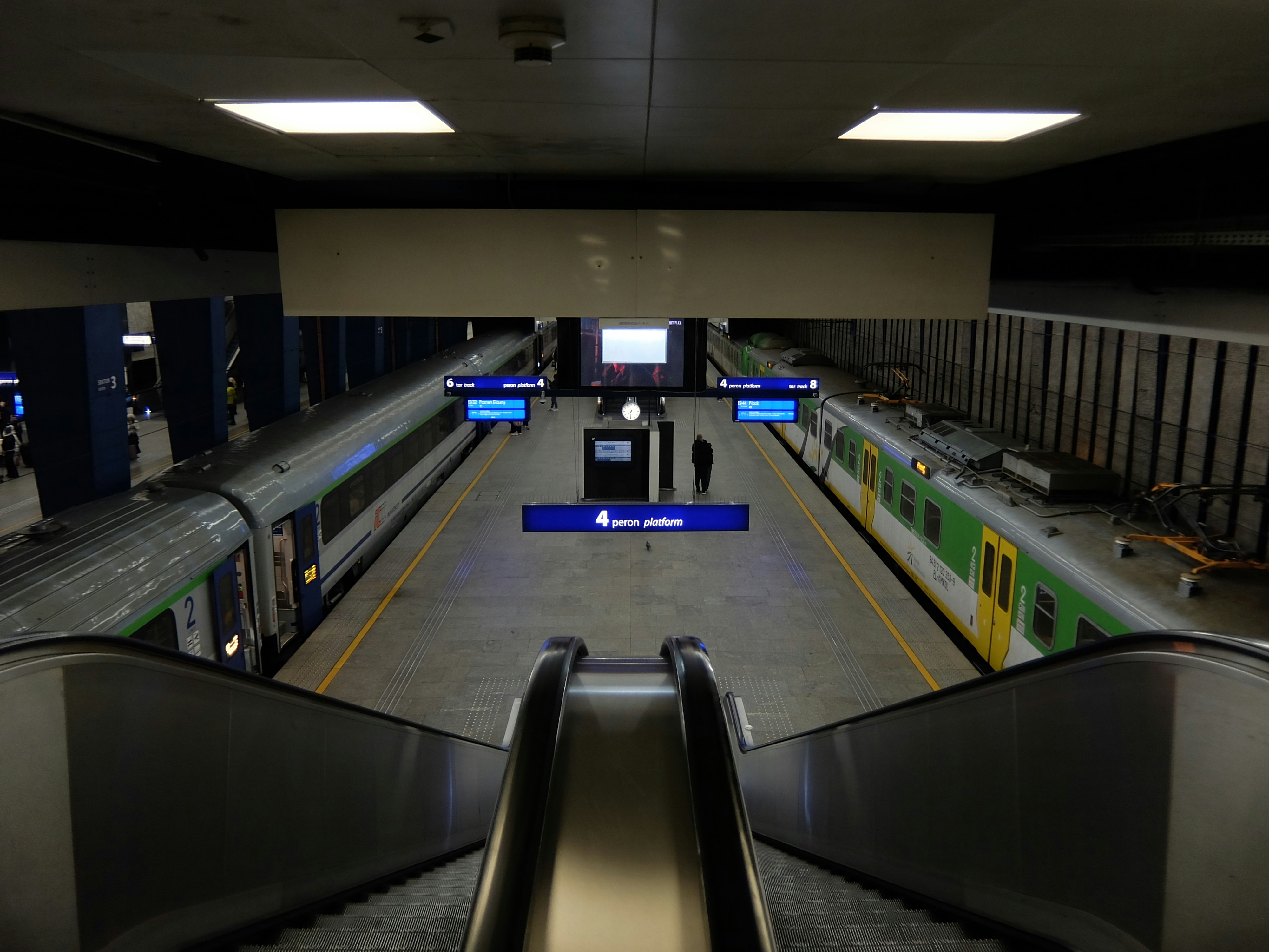 Two trains at a modern subway station platform