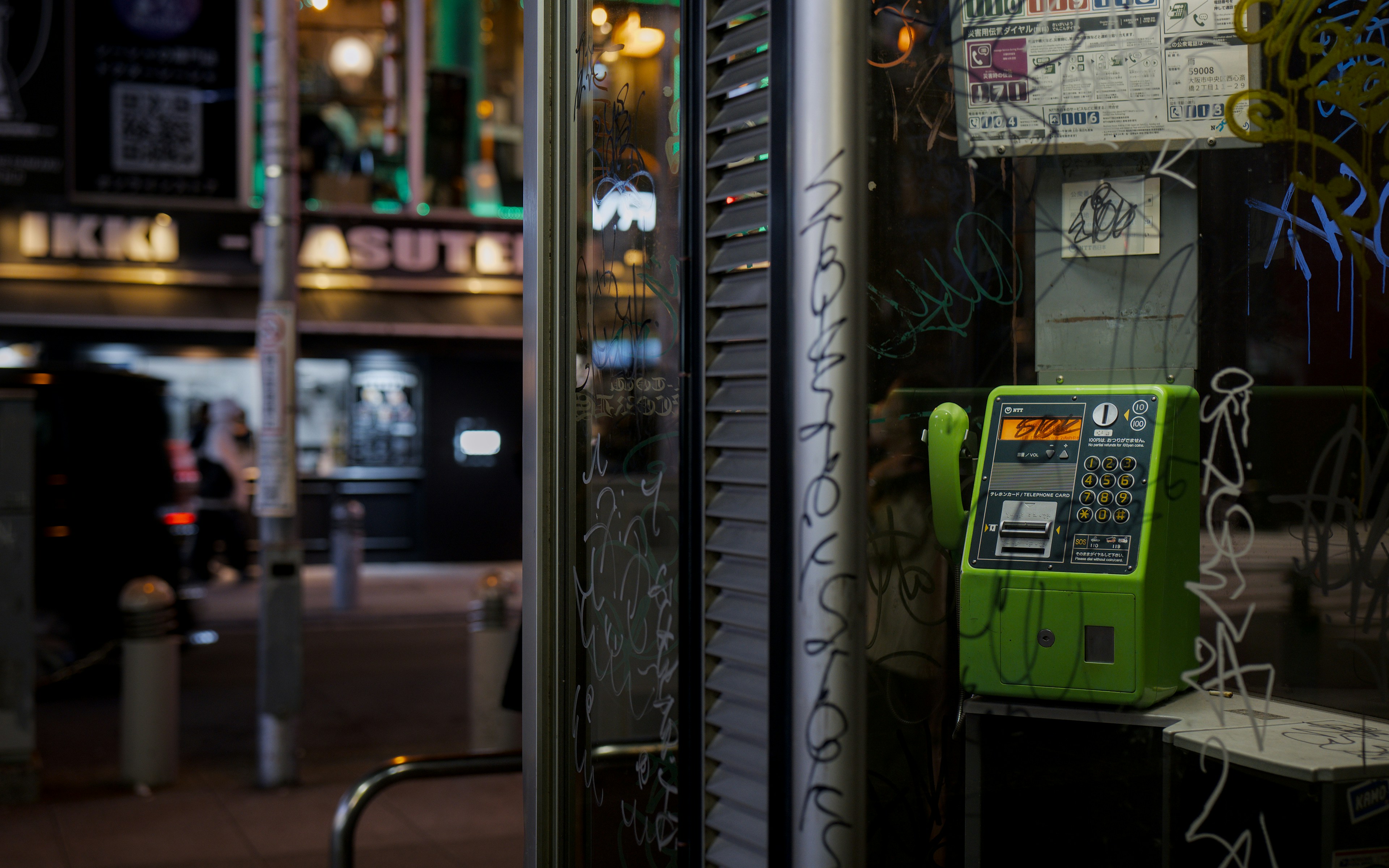 Side-by-side comparison of a City Gas meter on a building and a stack of LP gas cylinders