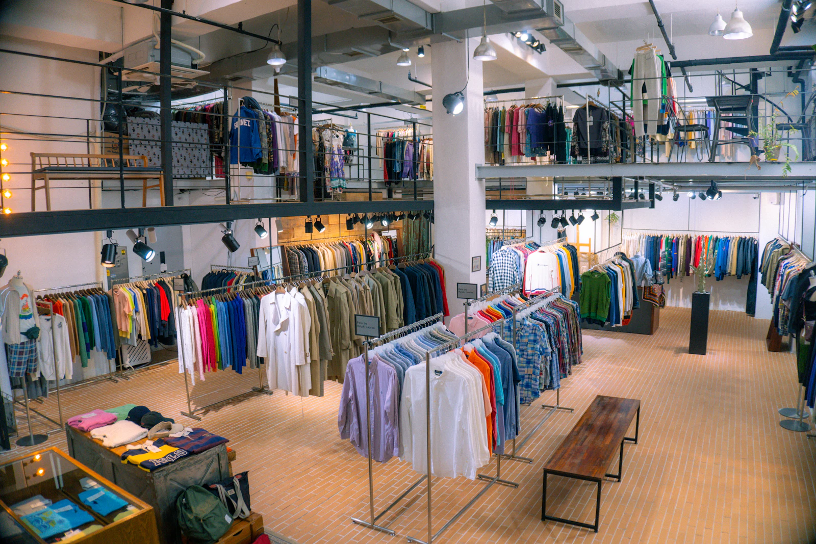 Clothing store interior with racks of apparel