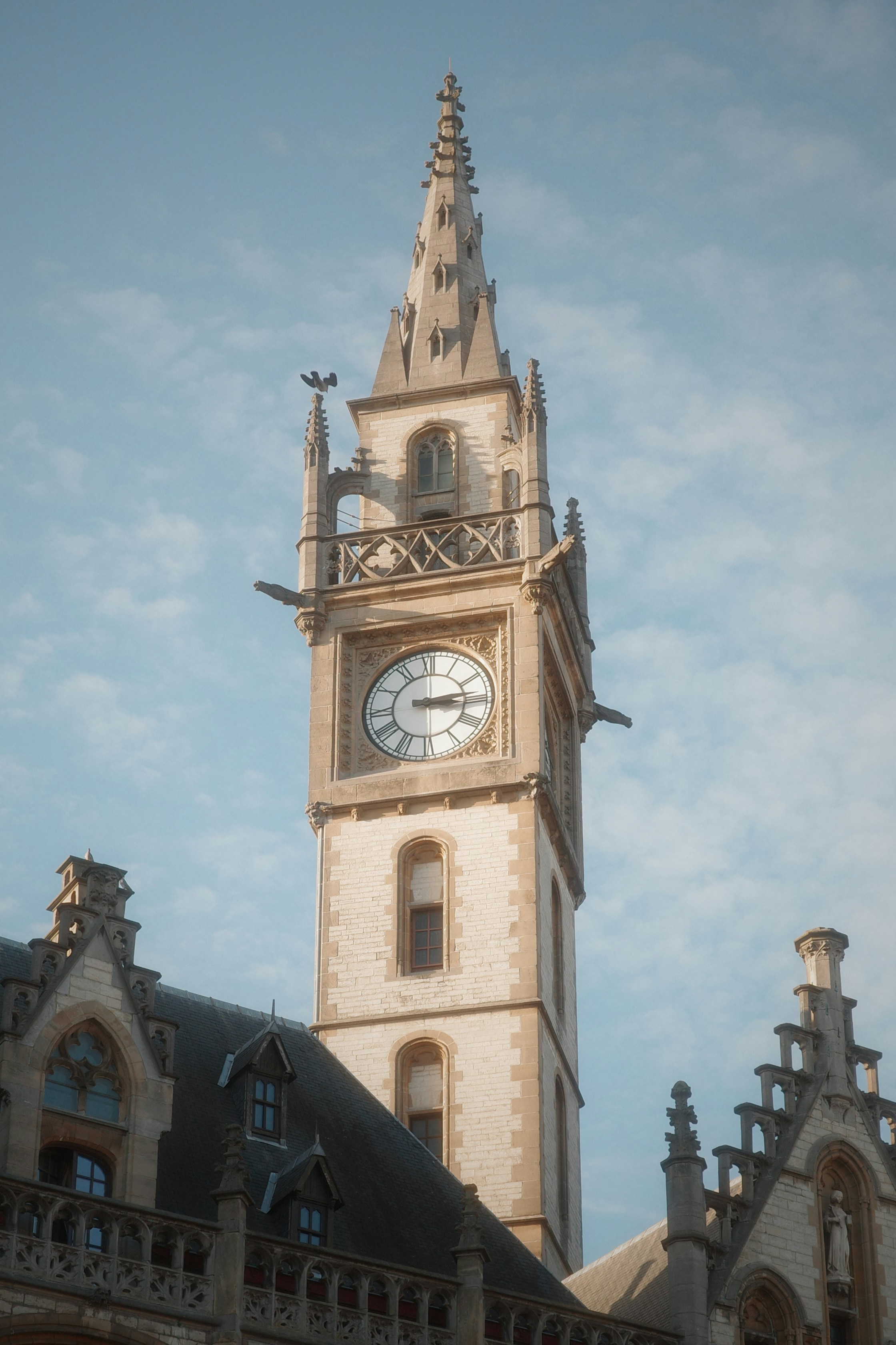 Tall clock tower with gothic architectural details