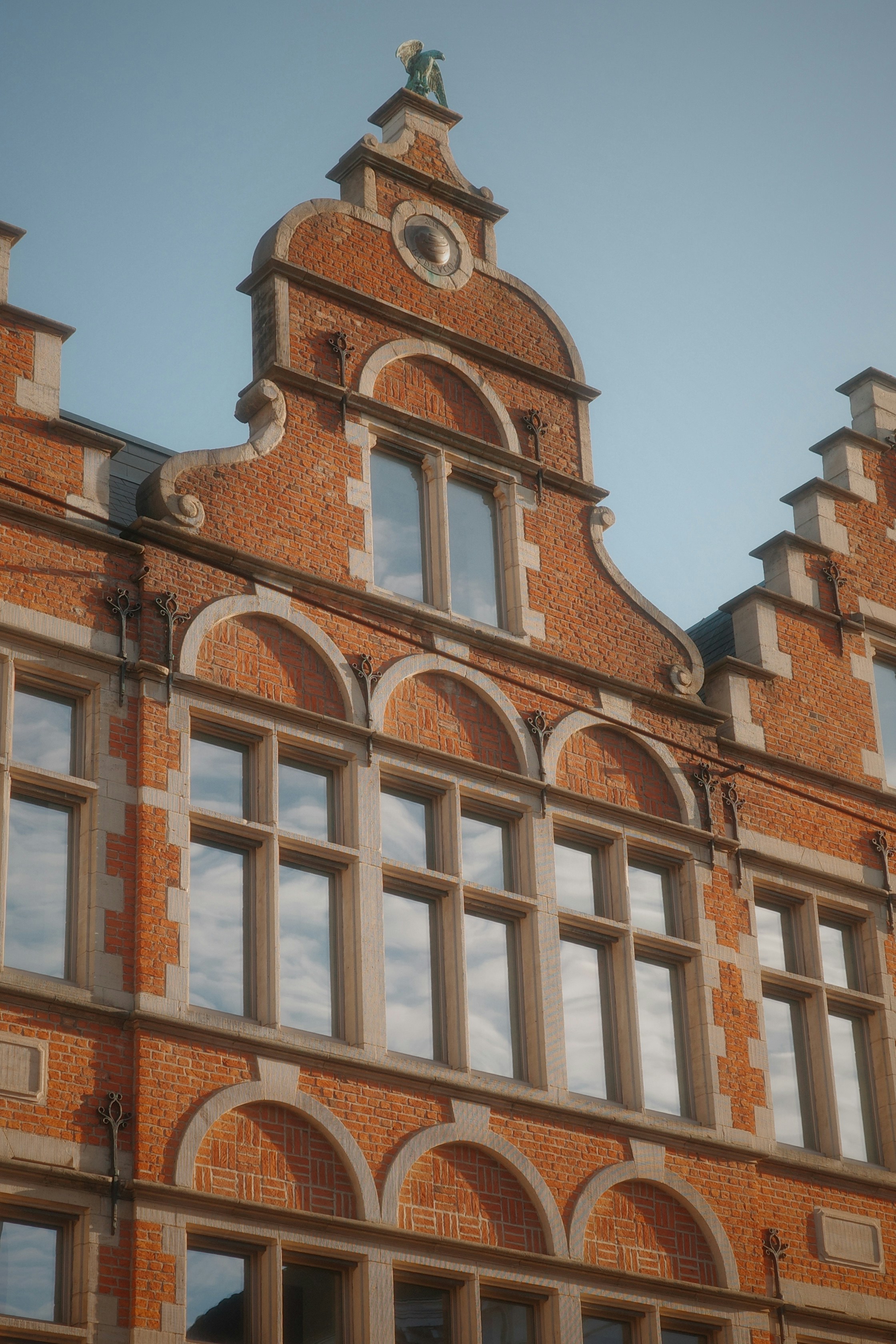 Ornate brick building facade with arched windows