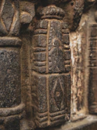 Close-up of ancient carved stone architectural detail.