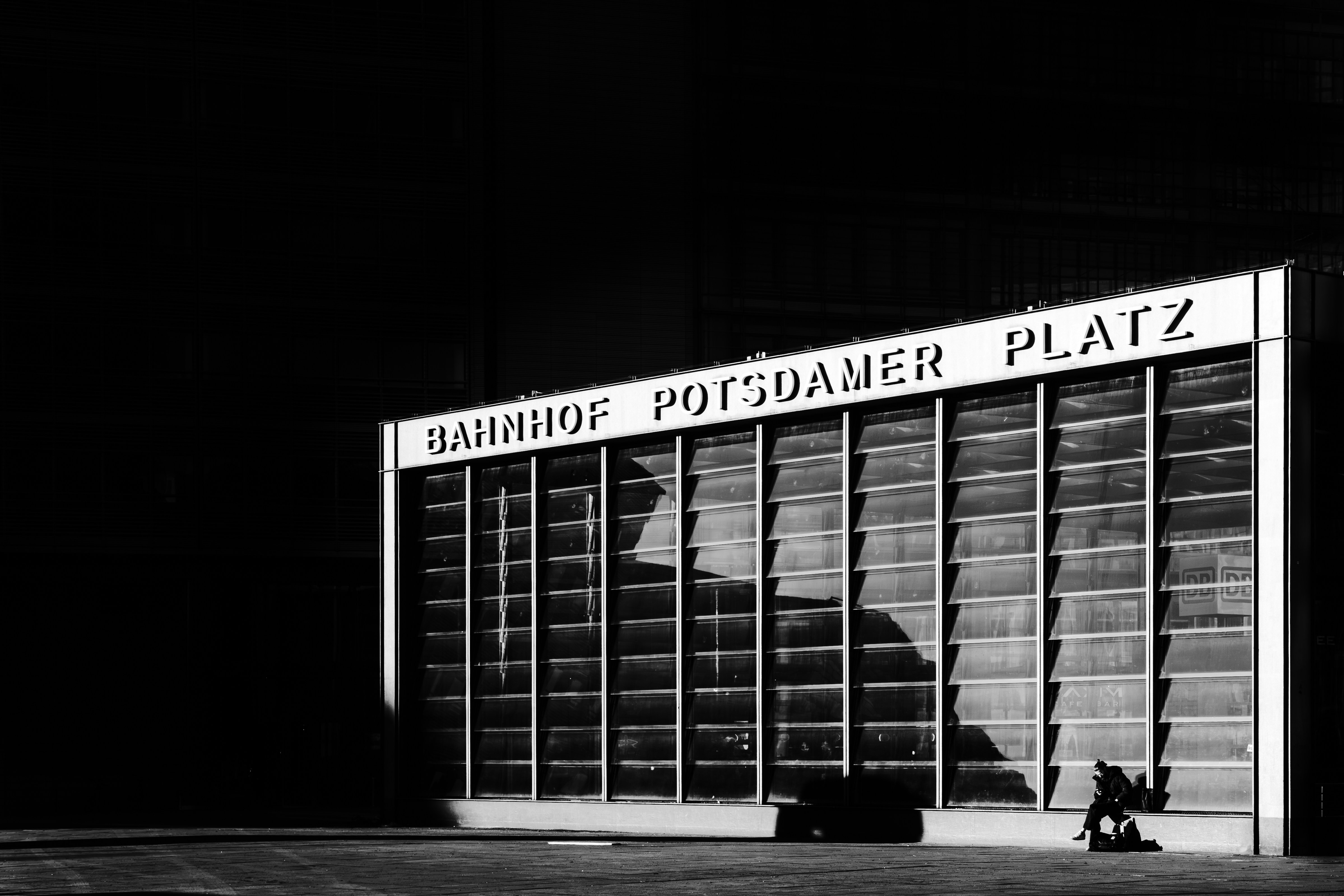 Modern building with "bahnhof potsdamer platz" sign