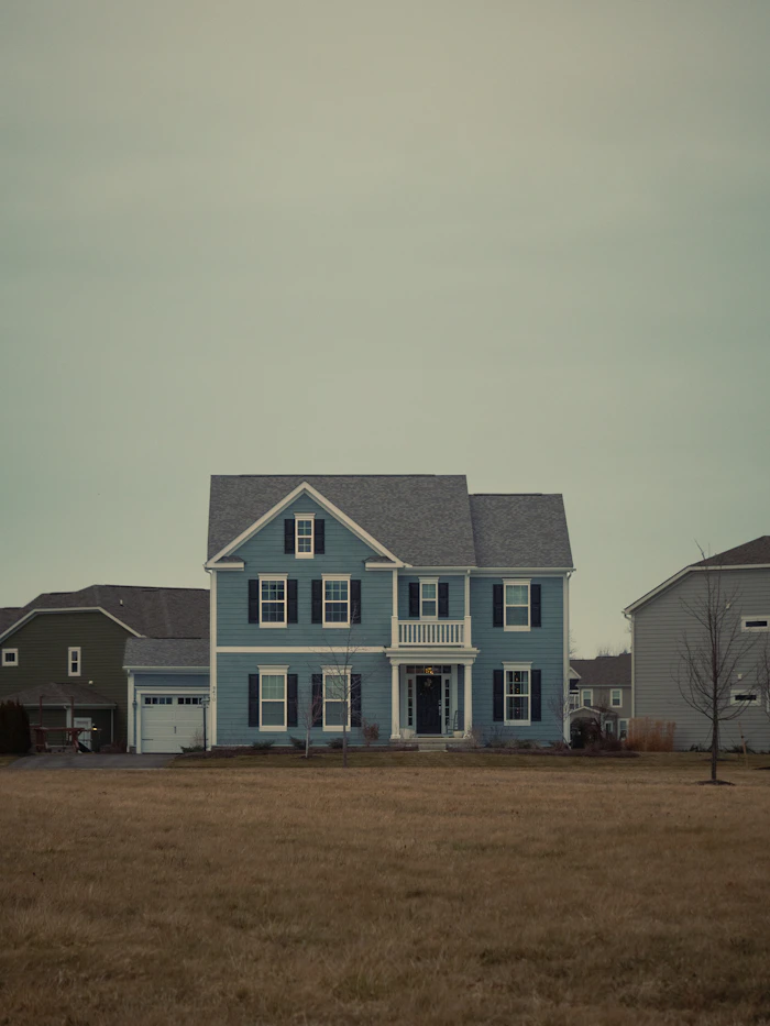 Two-story house with black shutters