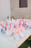 Bottles of hand sanitizer with pink bows and tags