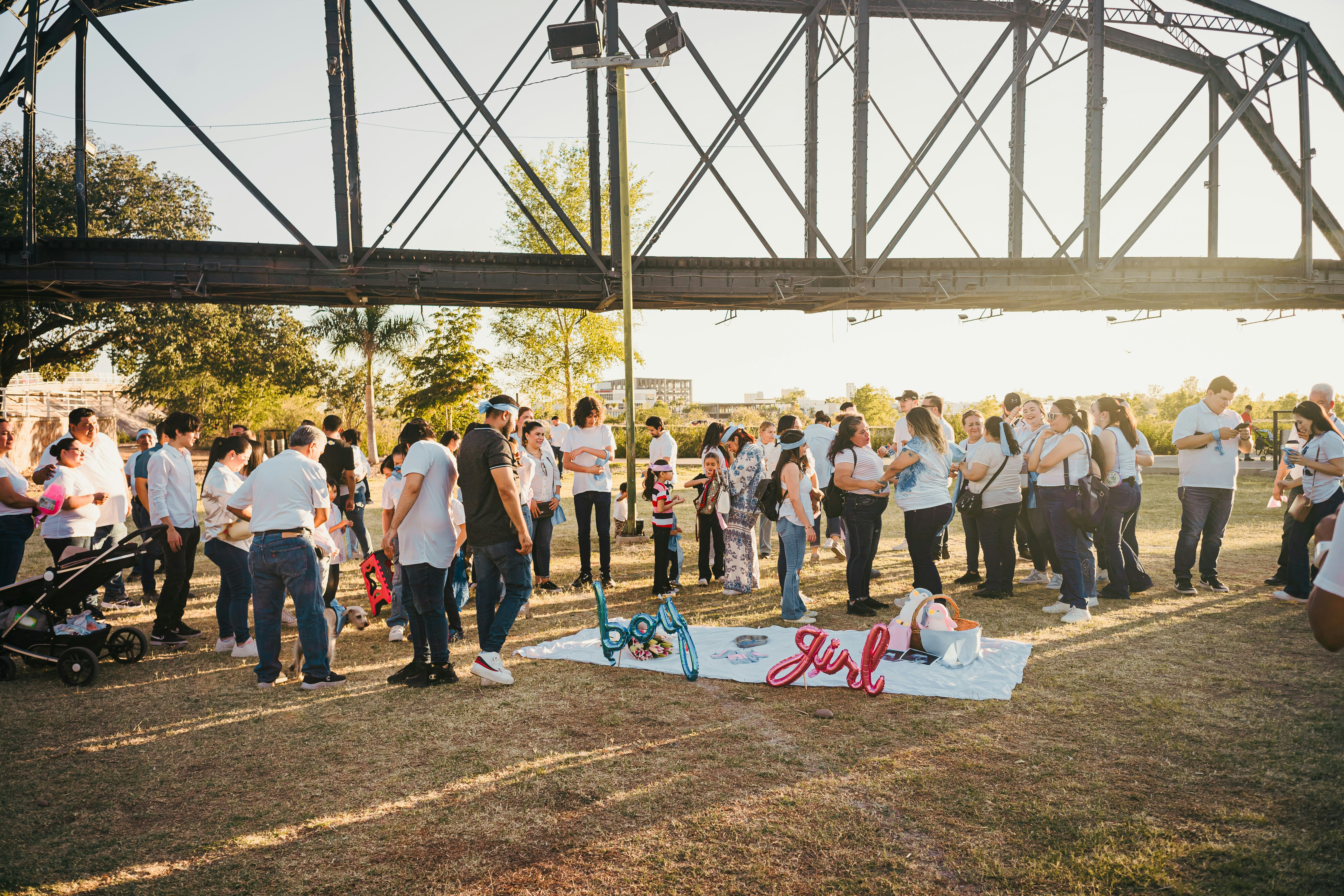 People gathered under a bridge for an event