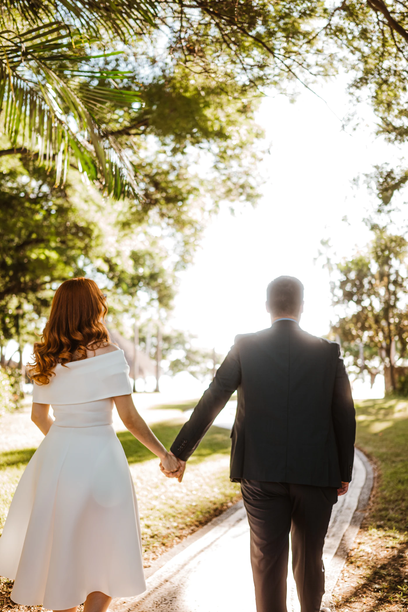 Married couple walking hand in hand, representing unity and oneness in marriage