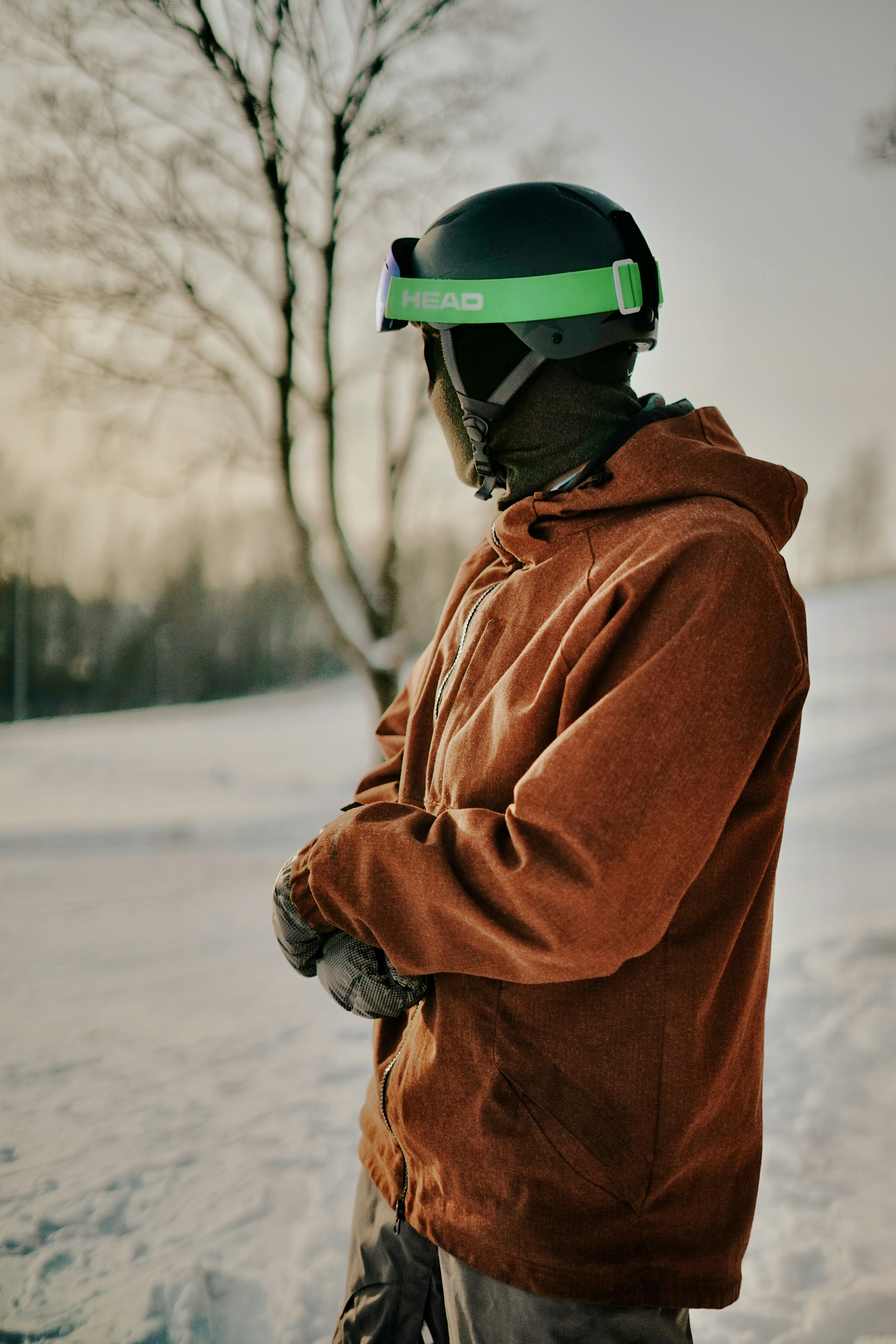 A person in winter ski gear standing in snow