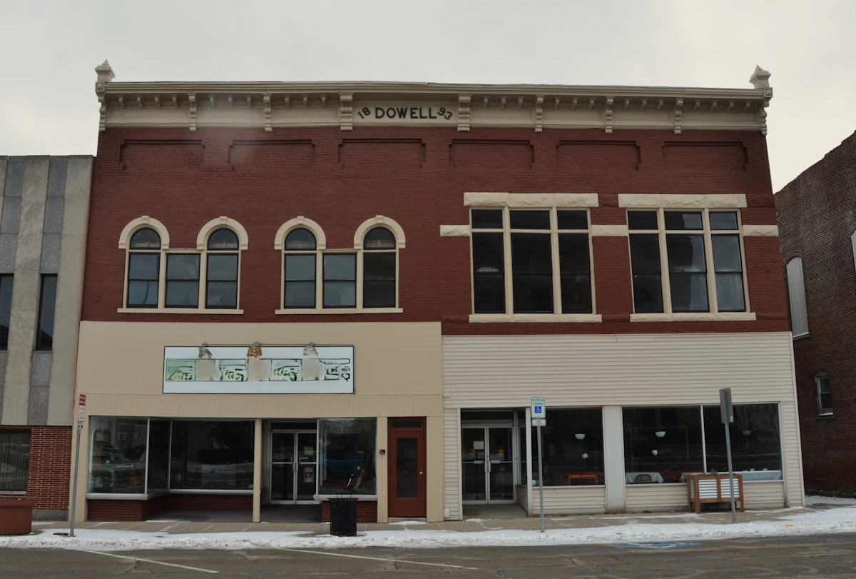 Well-kept two-story brick commercial building with ground-floor storefronts