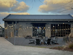 Modern building with outdoor seating and string lights