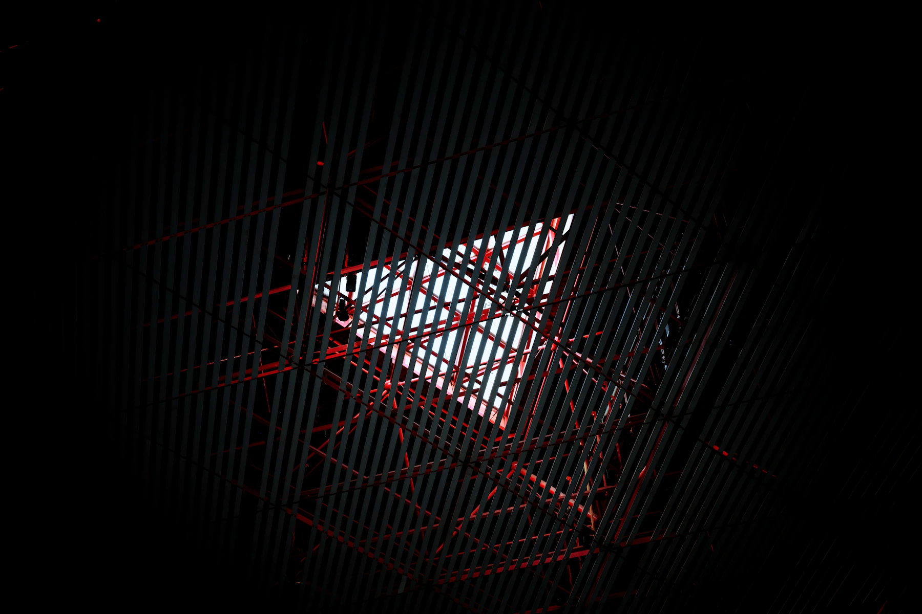 Abstract geometric structure with red accents and light
