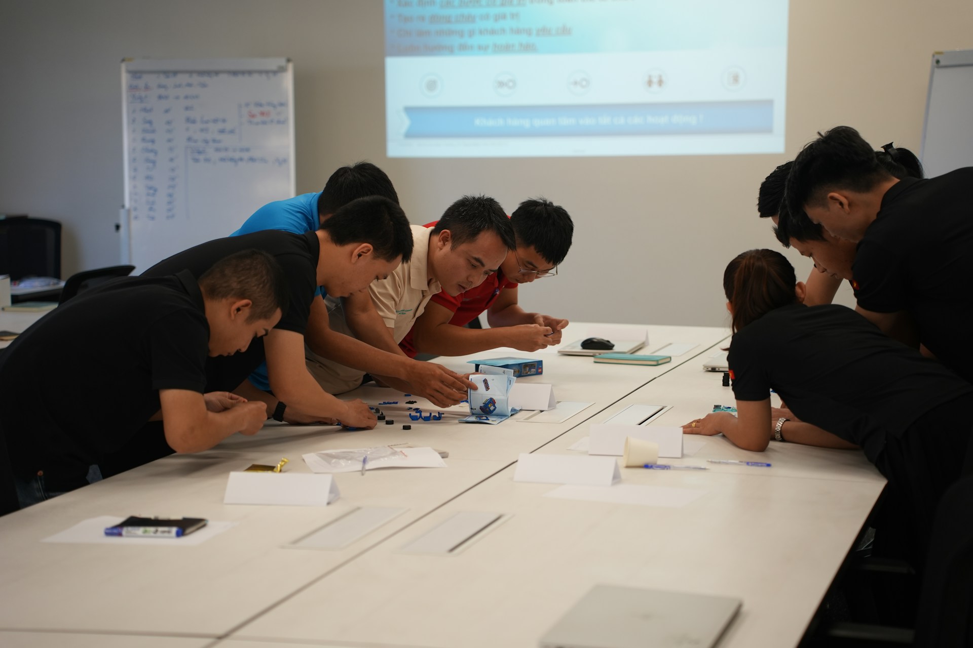 Team collaborating on a project at a table.