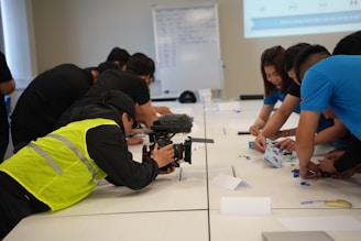 Group of people working on a project at a table.