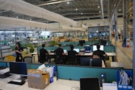 People working at computers in a modern office space.