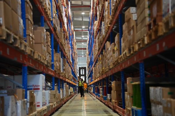 Rows of shelves filled with boxes in a warehouse.