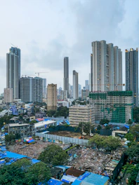 Modern skyscrapers rise above a dense urban landscape