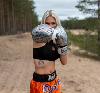 Woman in boxing gloves and shorts