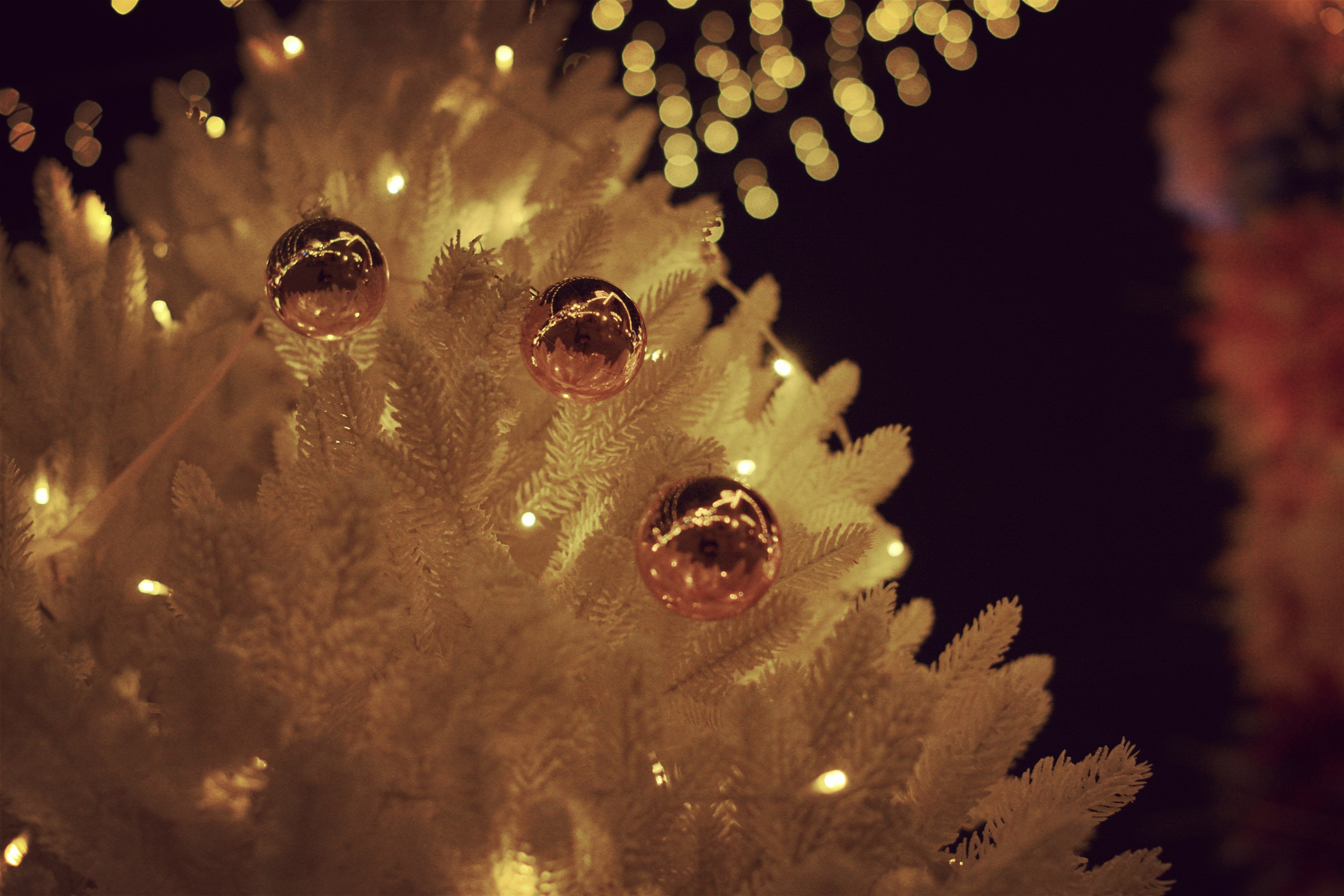 White christmas tree with golden ornaments and lights