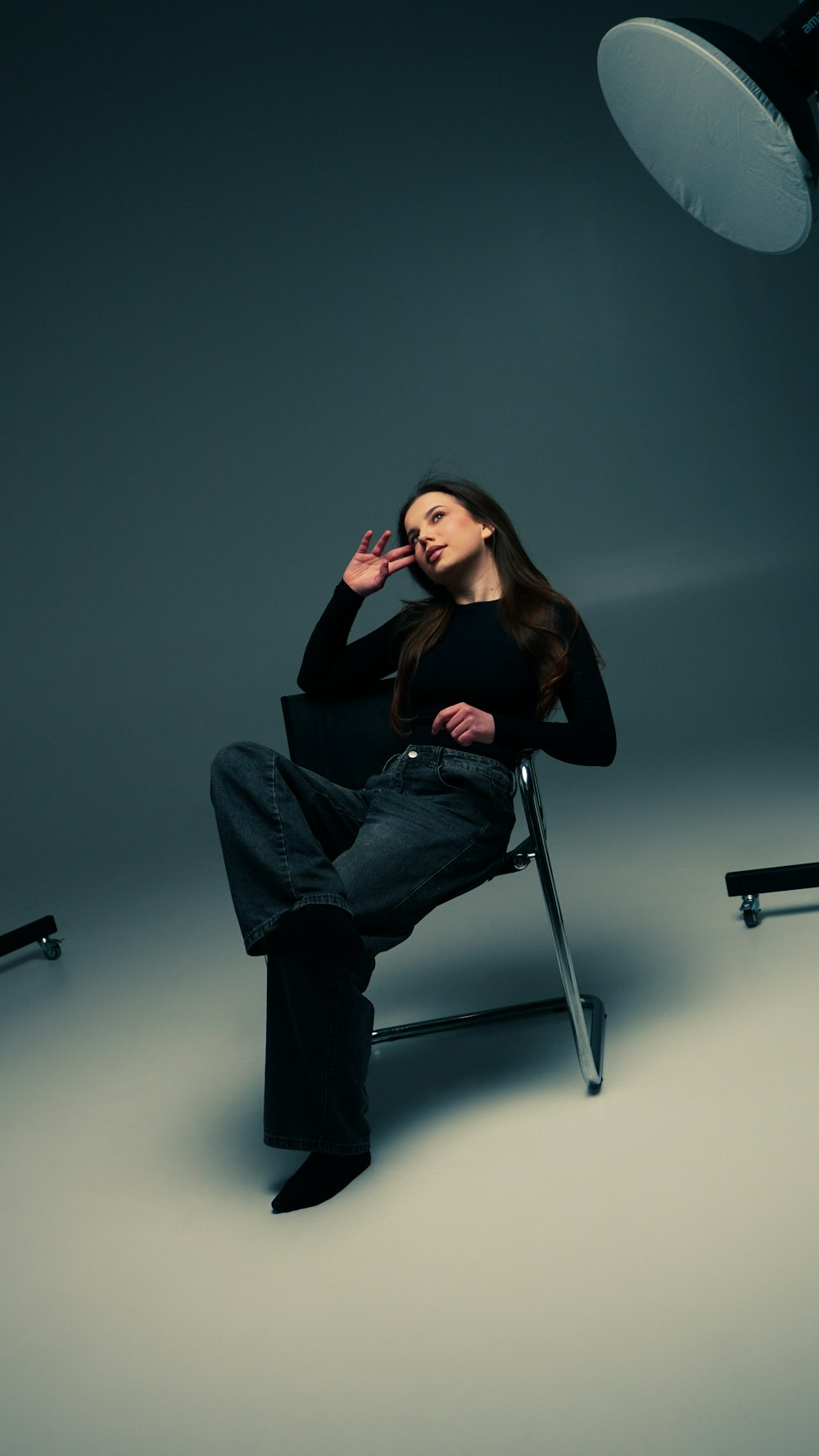 Fashion model in dramatic studio lighting demonstrating professional light setup