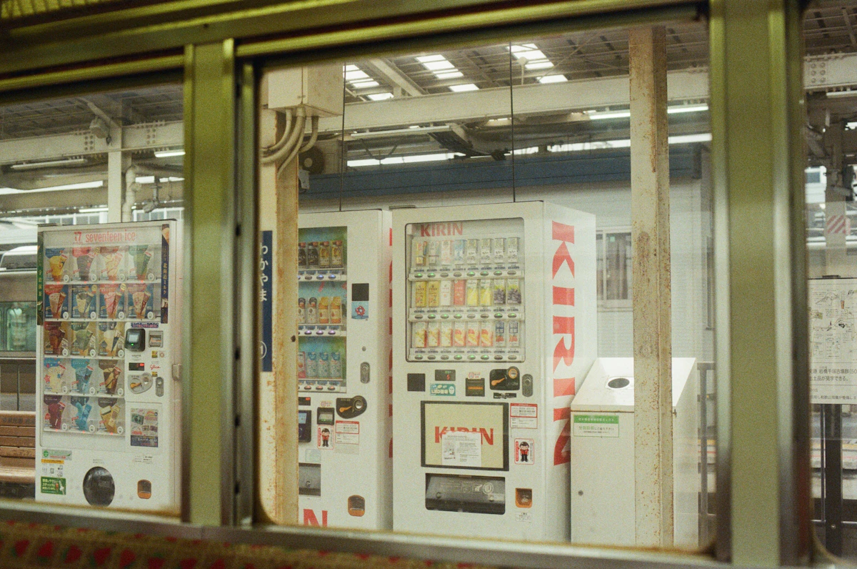 Drink vending machines lined up at a Japanese train station platform