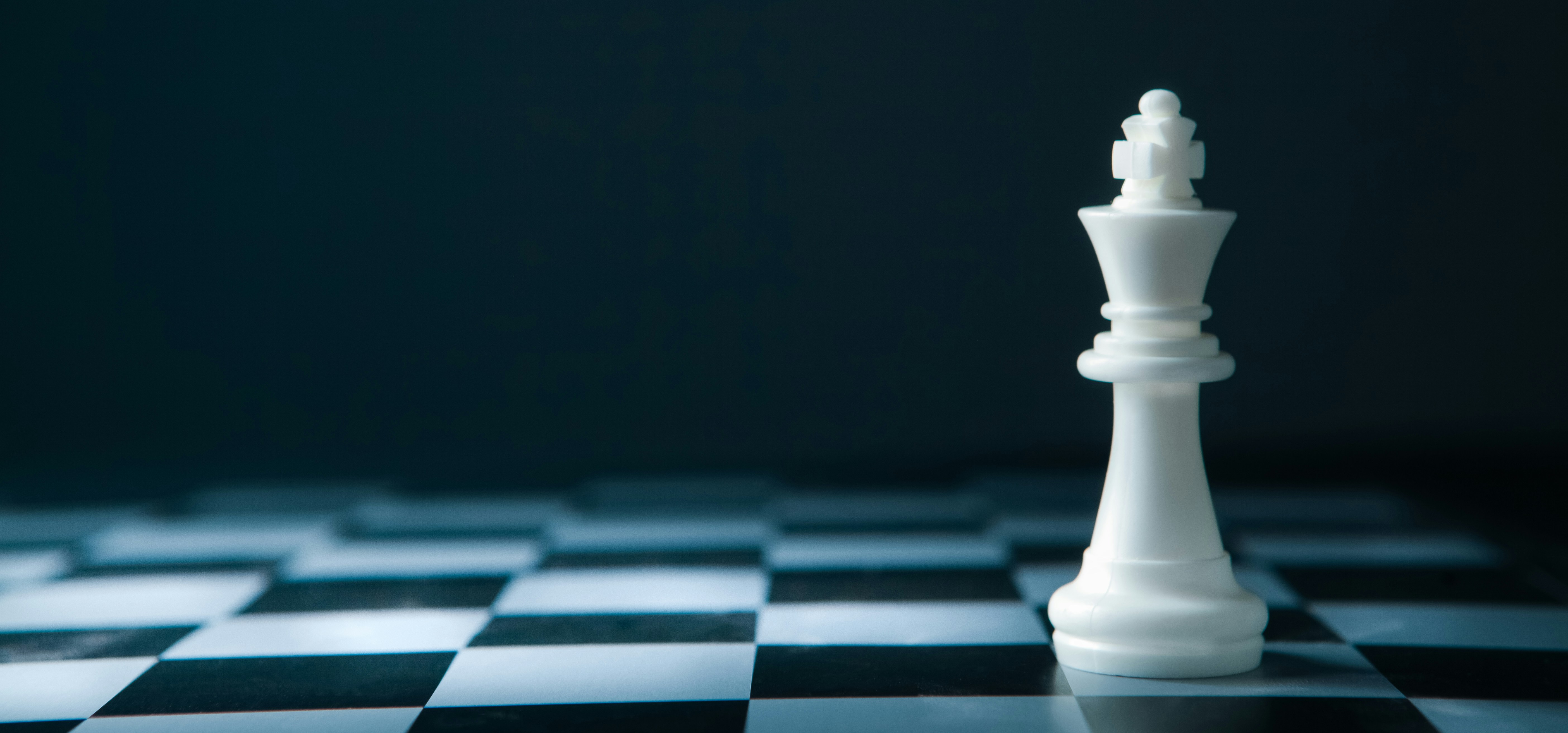 White chess king on a chessboard