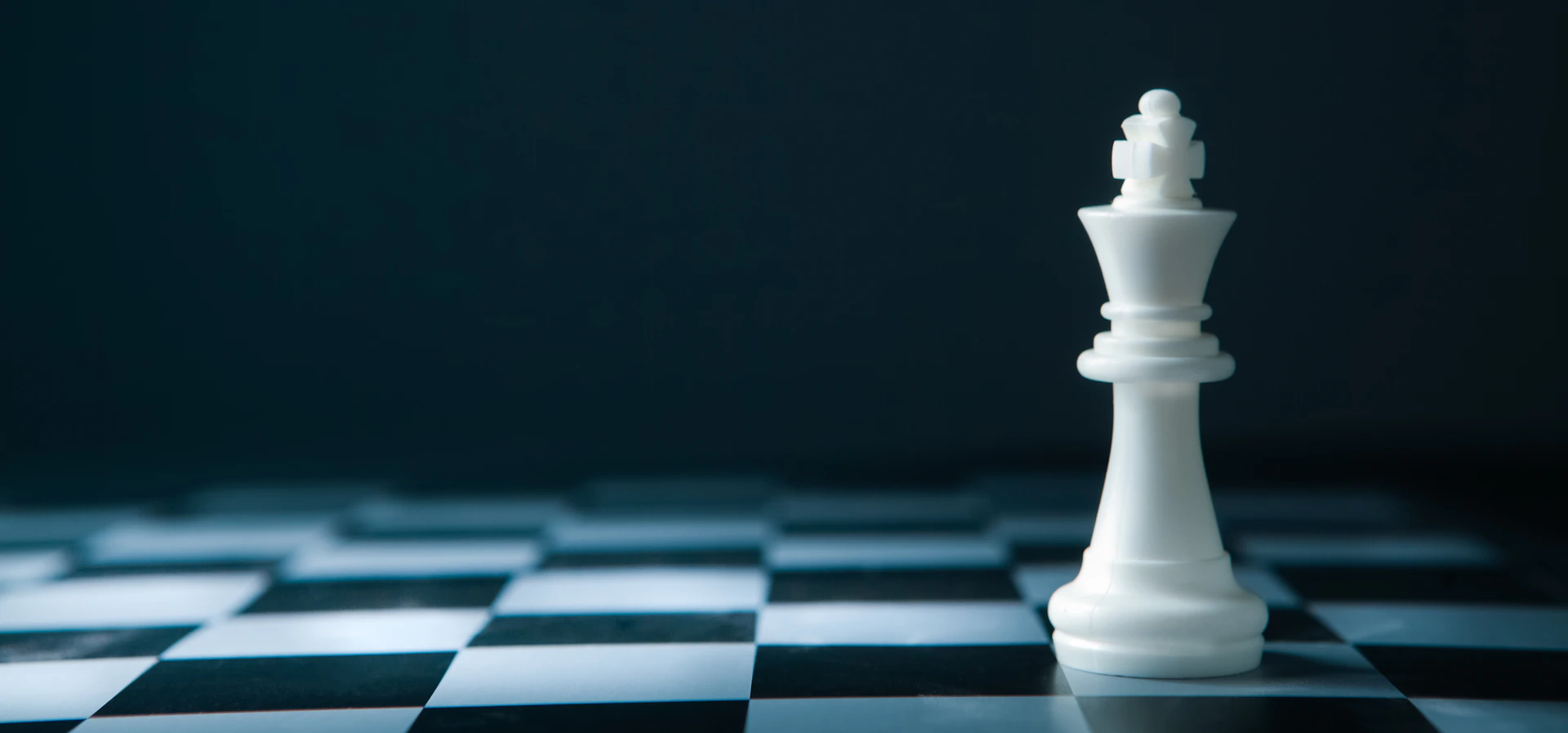White chess king on a chessboard