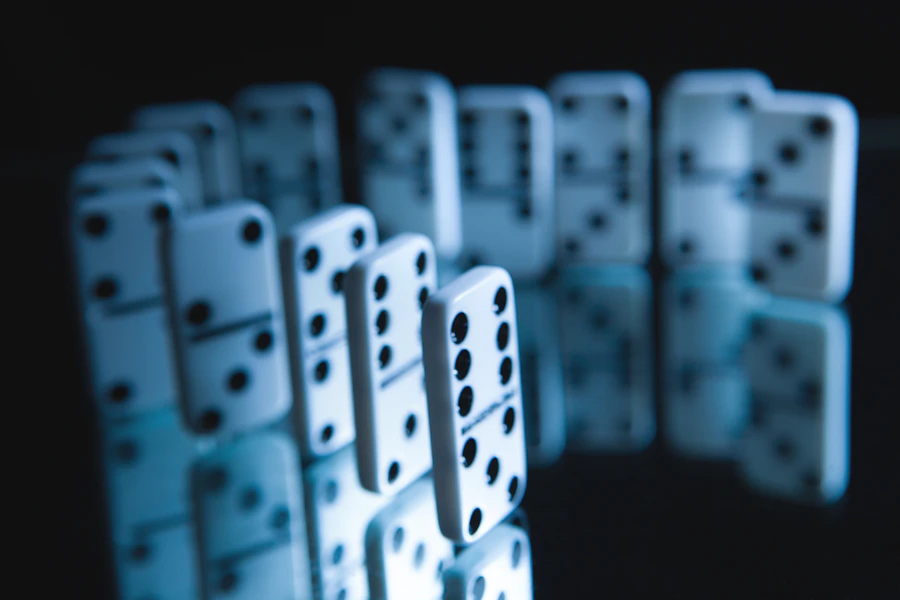 A line of dominoes poised to fall