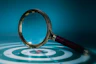 Magnifying glass over a target with bullseye