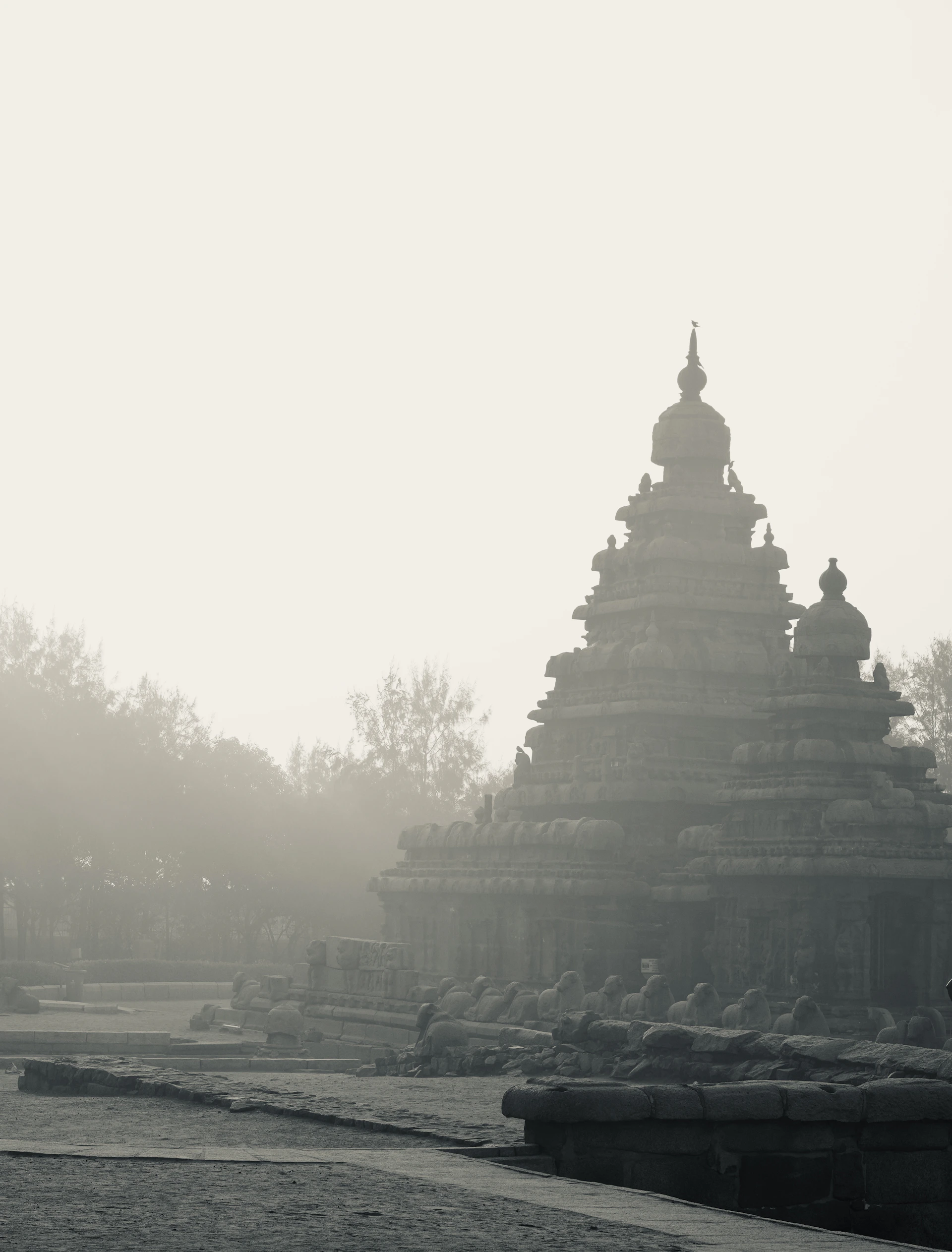 Misty morning at an ancient stone temple complex