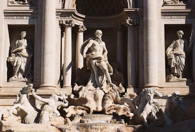 Baroque sculptures of neptune and horses on a fountain
