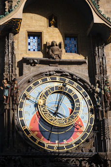 An ornate astronomical clock face with intricate details.