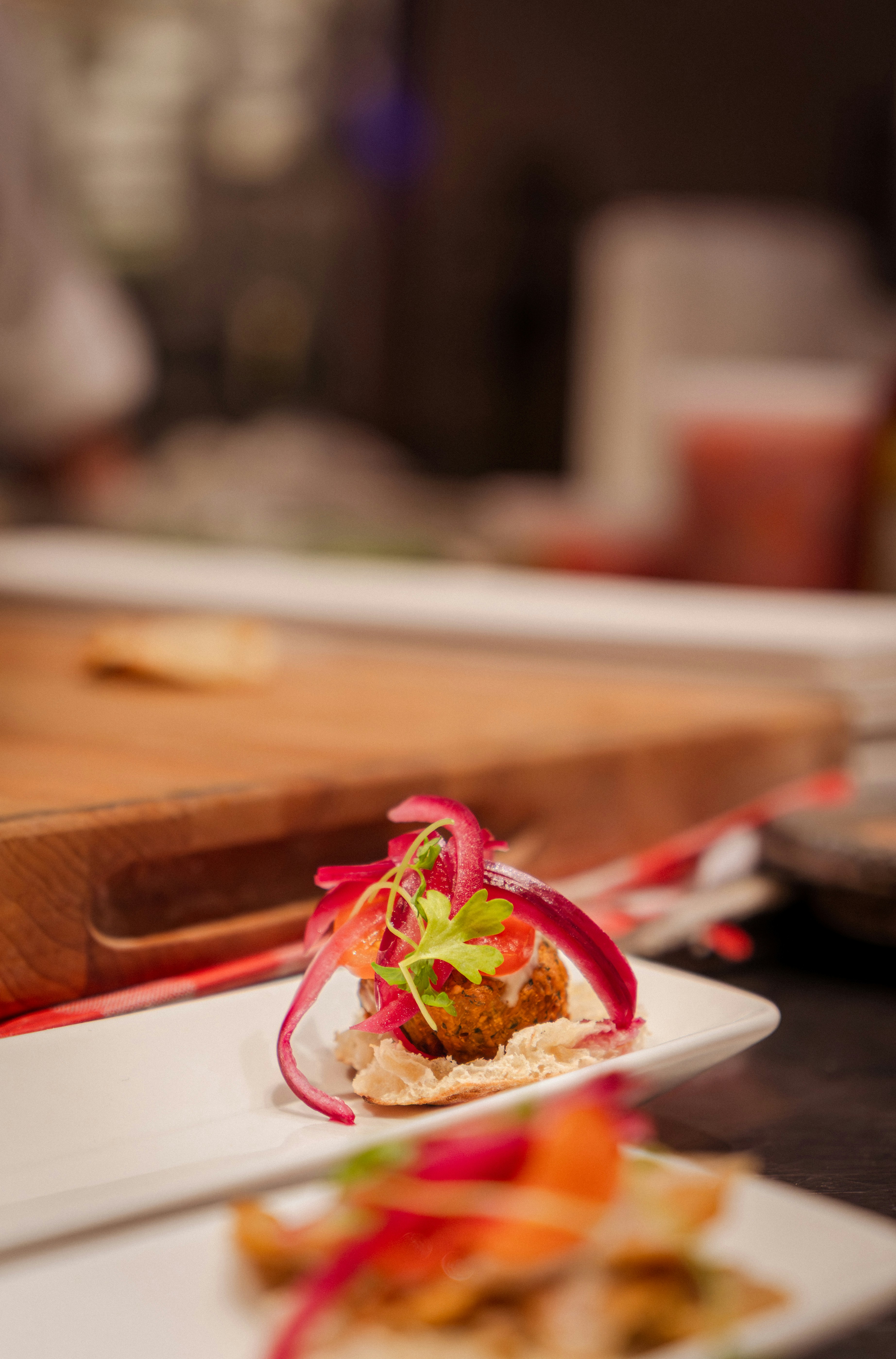 Gourmet appetizer with pickled onions and microgreens