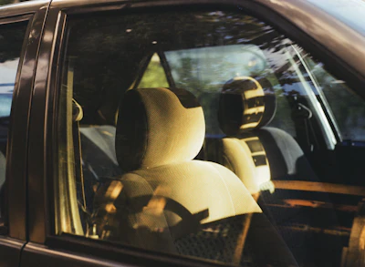 Interior of a car with light-colored seats.