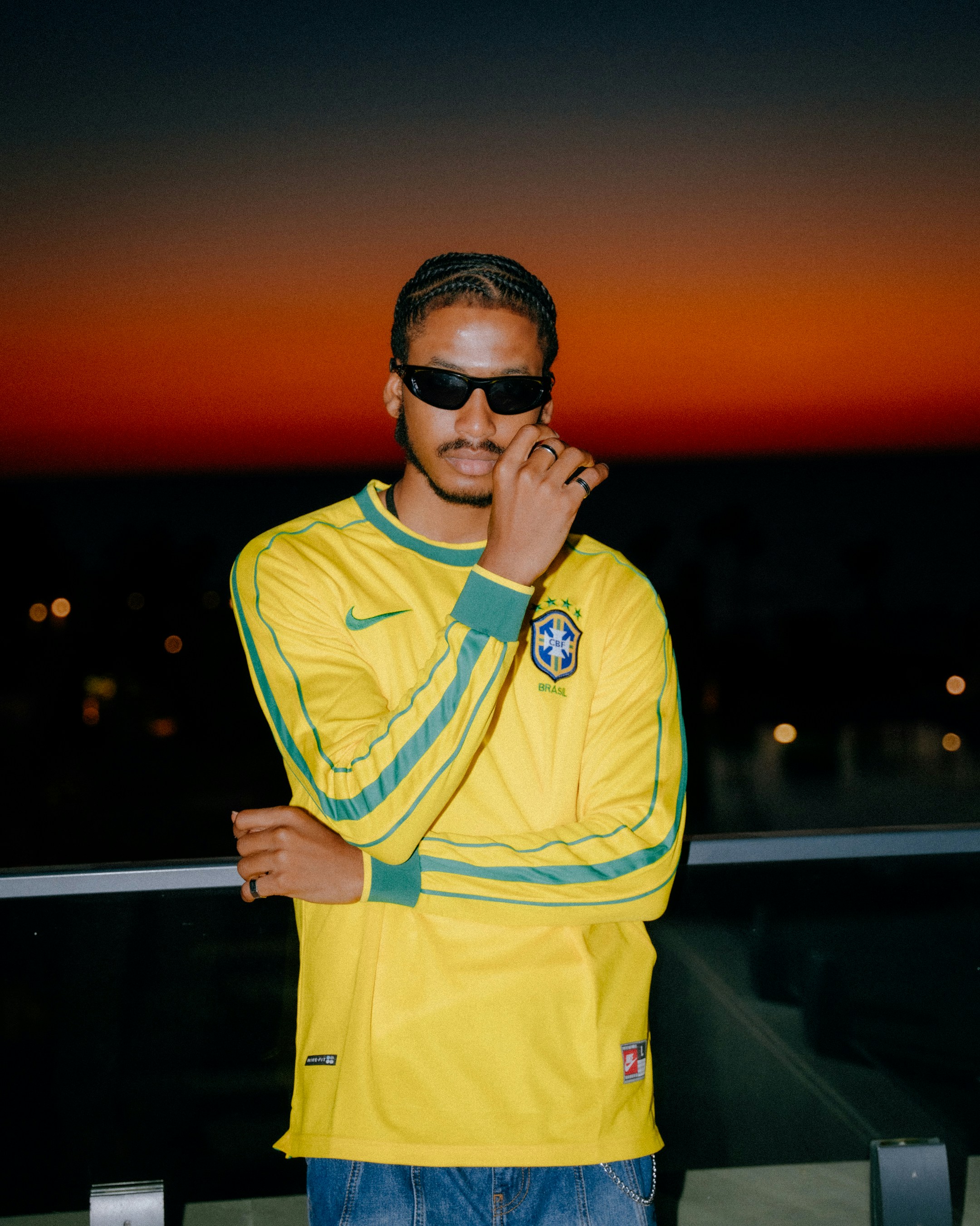 Man in yellow jersey at sunset