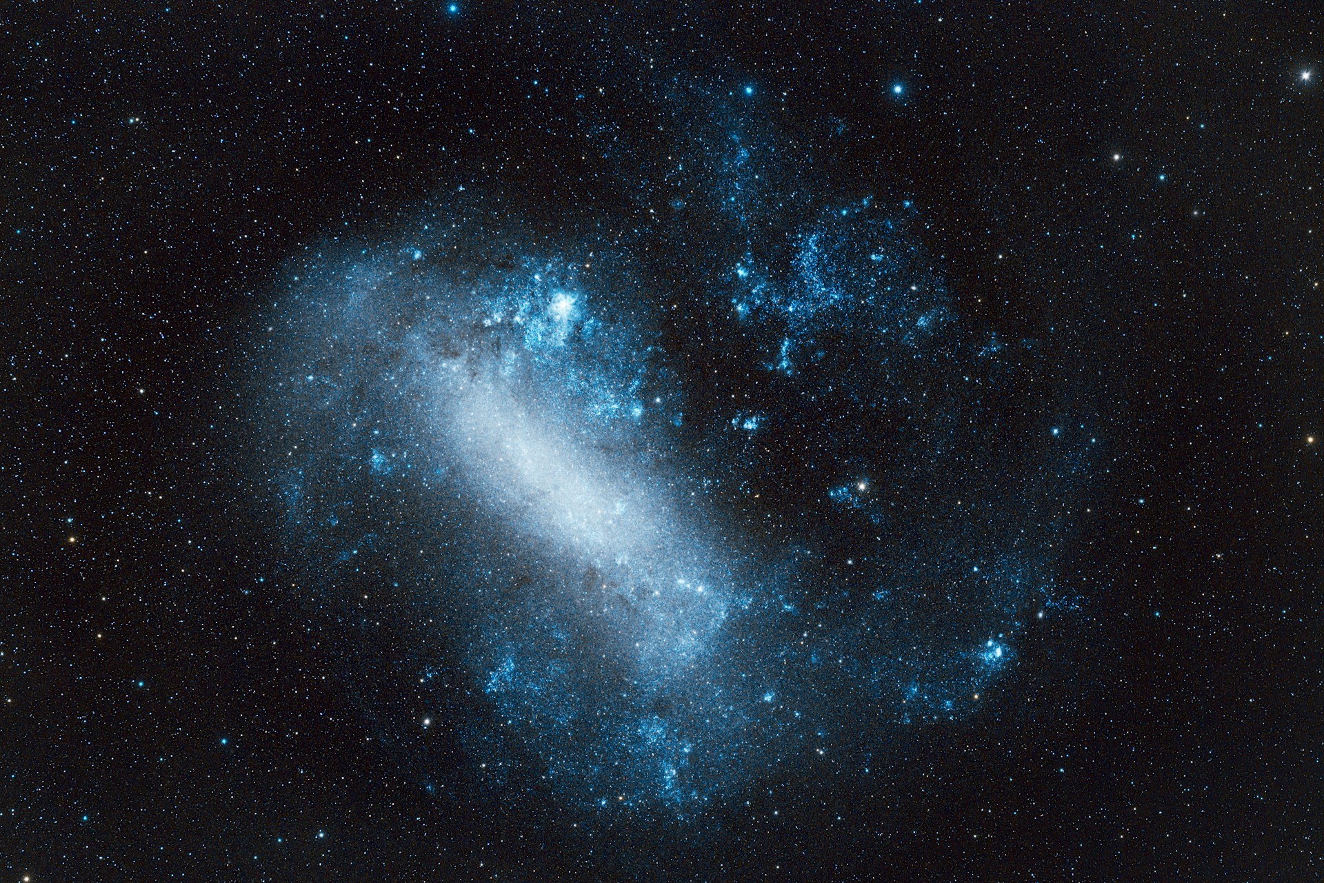 A blue nebula in the vastness of space