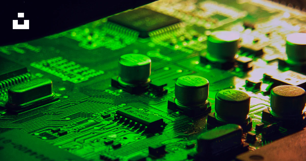 Green Transistor Components Close-up of a green circuit board with electronic components. photo ...