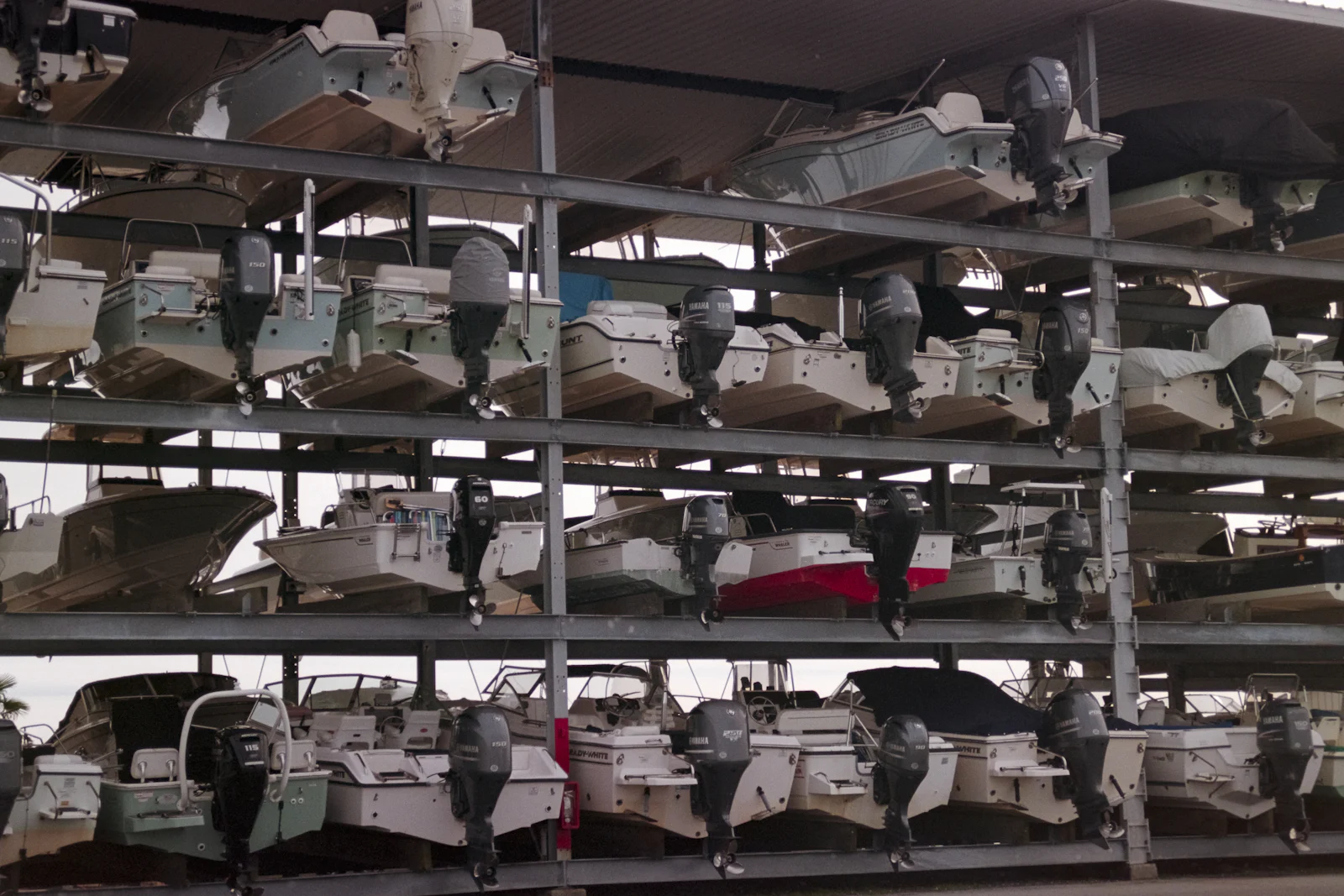 Boats stored on multi-level dry-stack racks