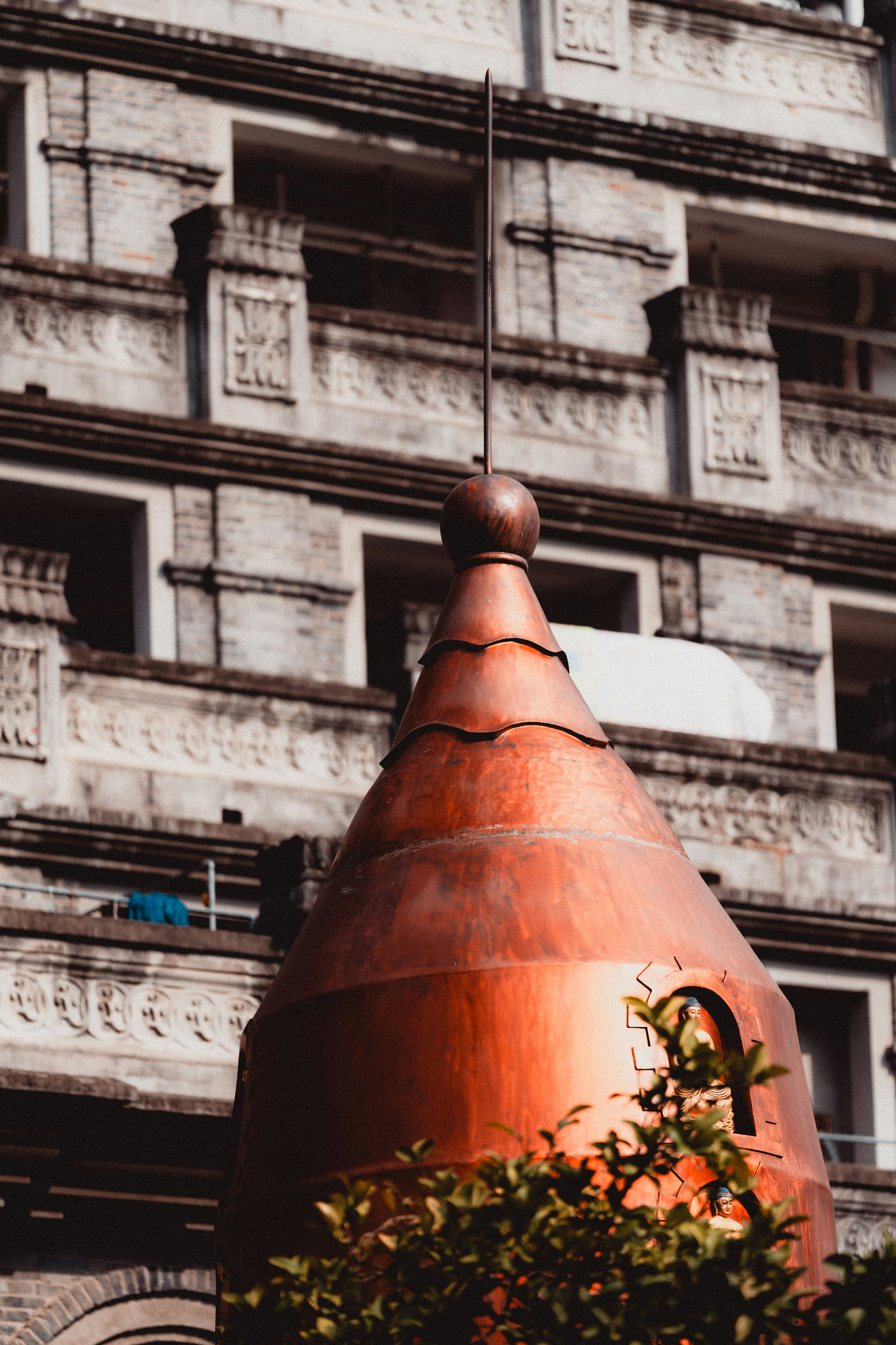 Copper dome atop an ornate building facade