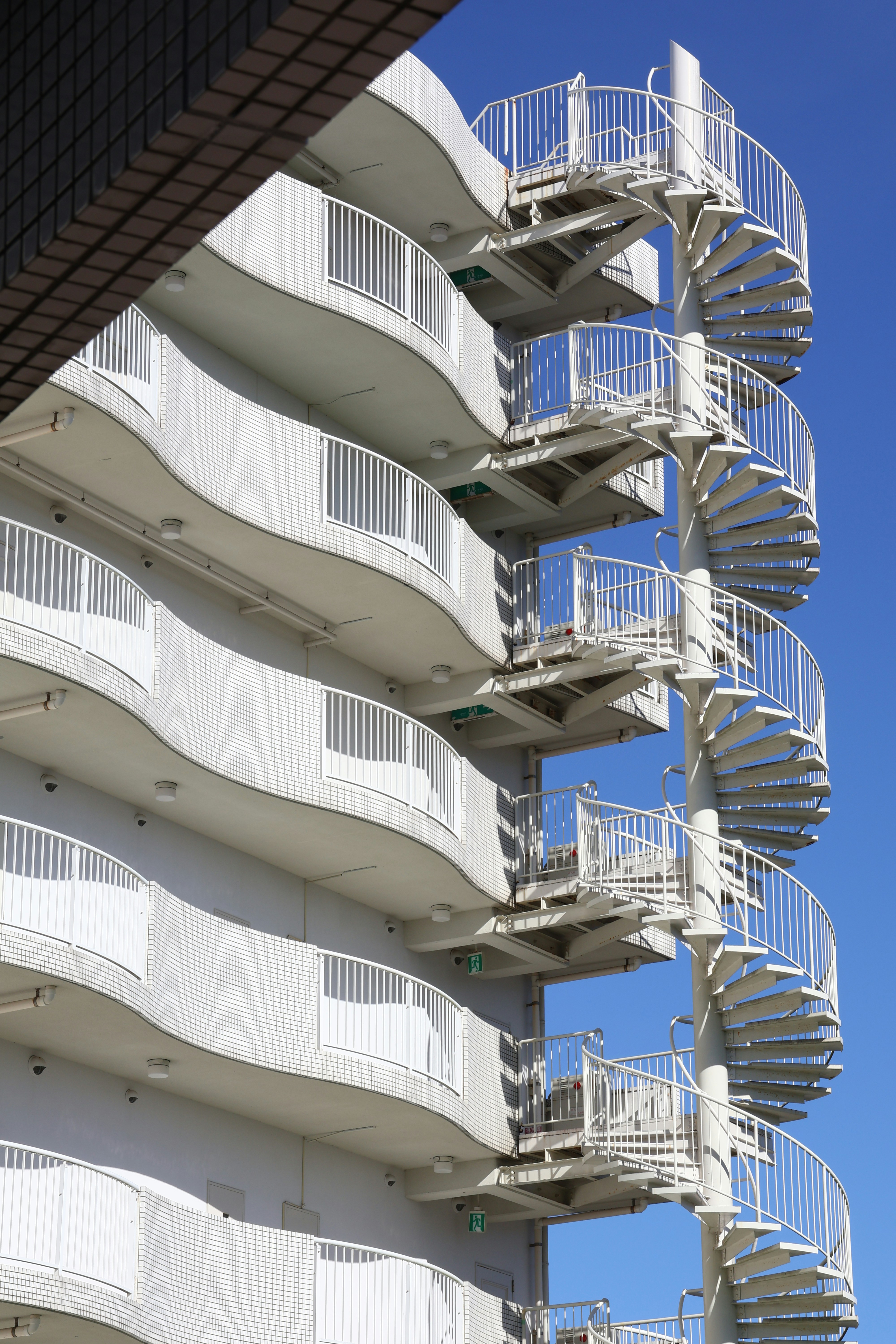 White spiral staircases on a modern building