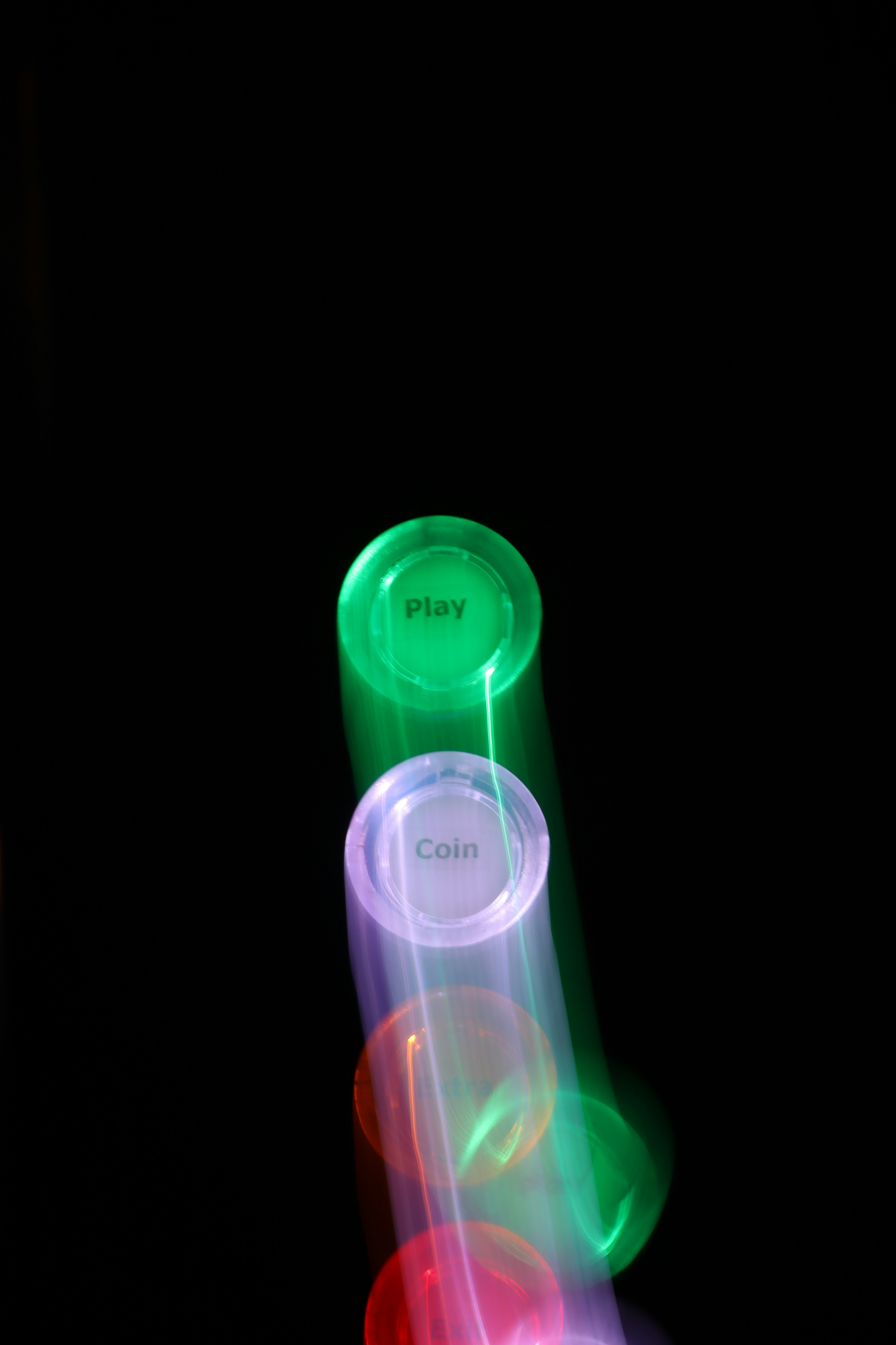 Glowing buttons with motion blur on black background