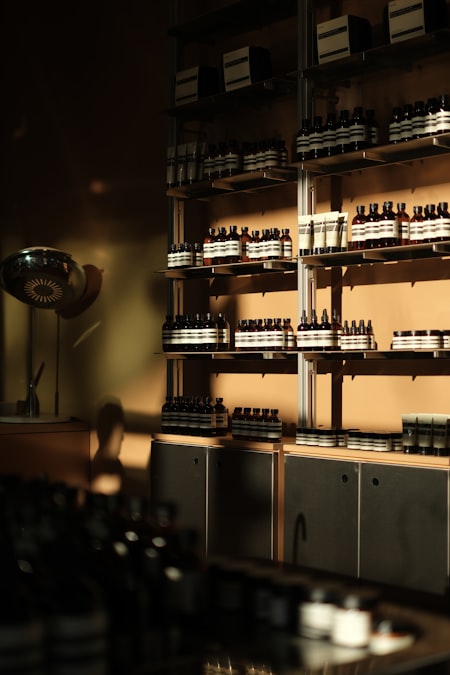 Rows of skincare product bottles arranged on retail shelves, the setting where a shopper's sense of whether a DTC brand's price feels fair gets formed