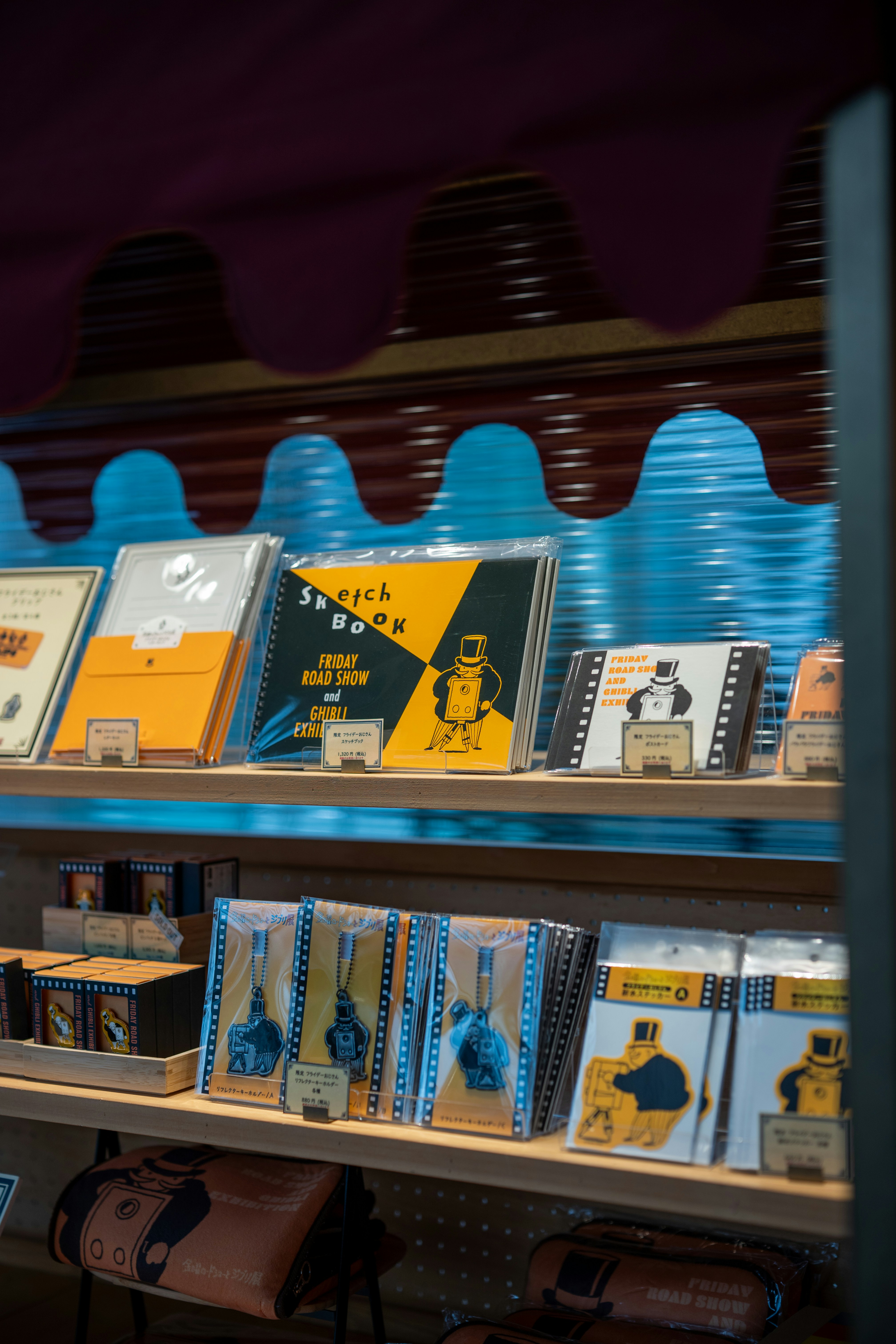 Sketchbooks and other stationery items on shelves