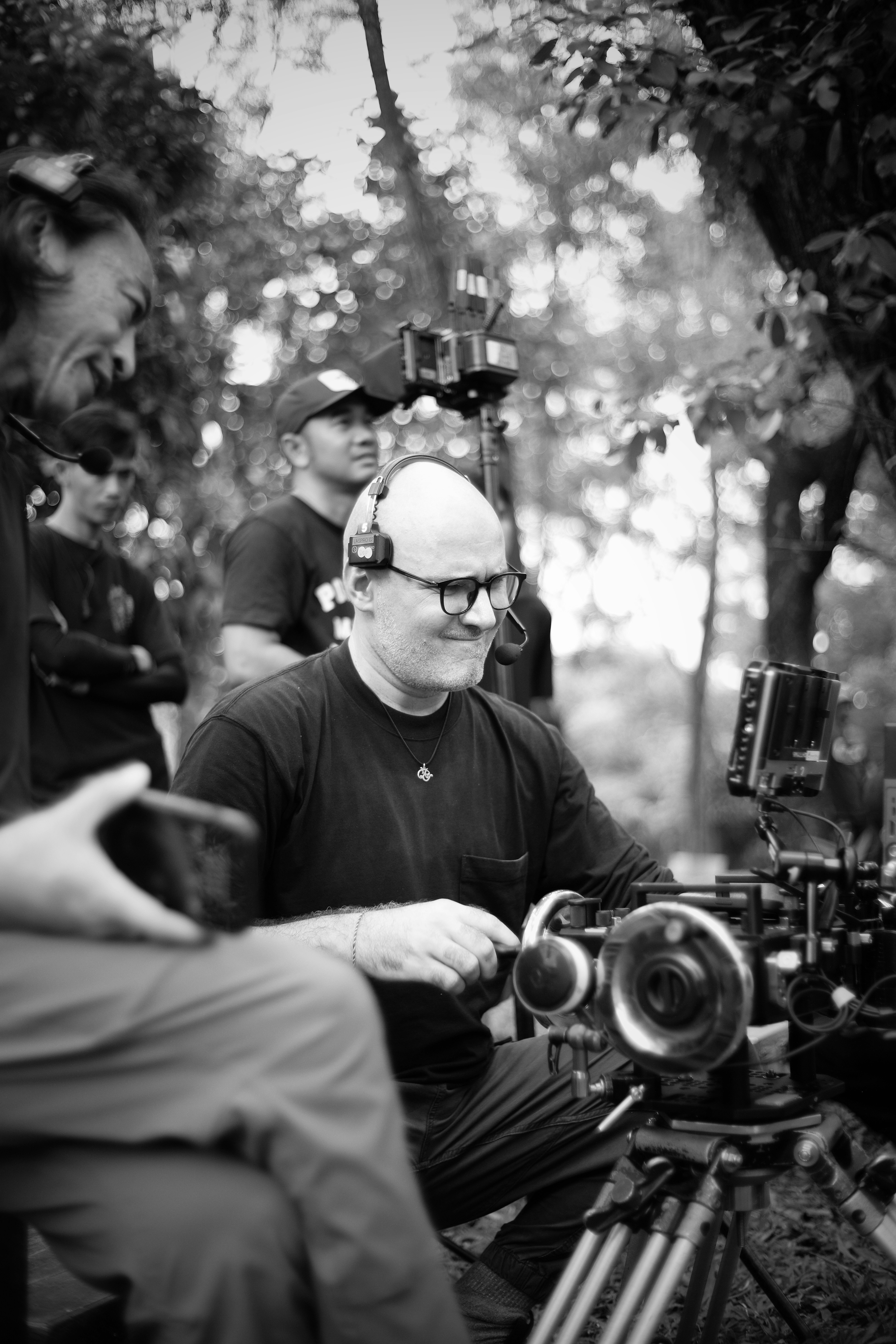 Filmmakers operating camera equipment on set.