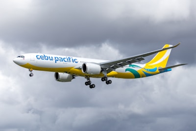 Cebu pacific airplane flying in cloudy sky