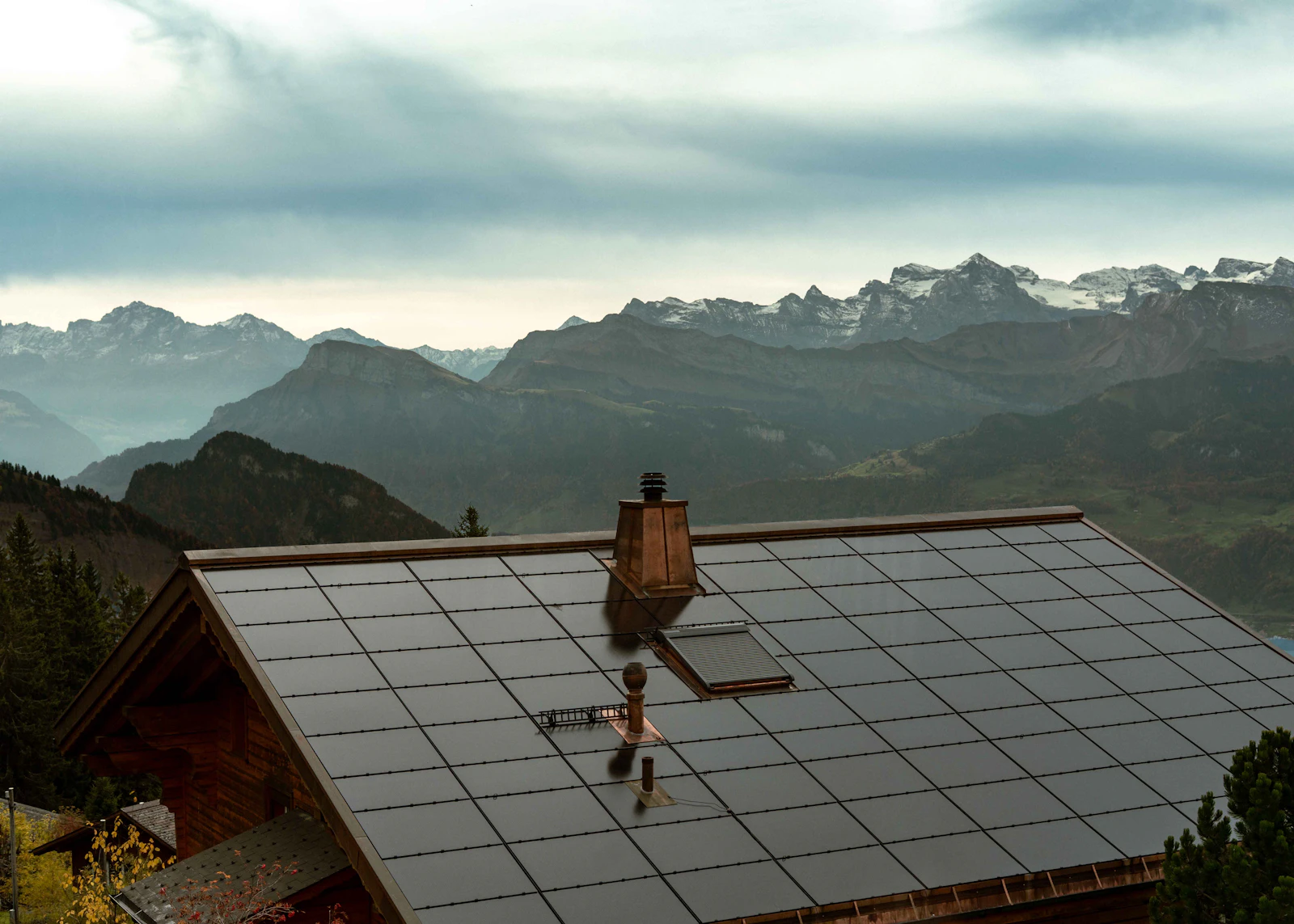 Solar panels covering the roof of a mountain cabin