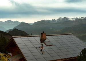 Solar panels covering the roof of a mountain cabin