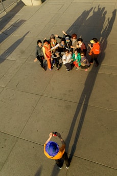 A group of people posing for a photo outdoors.